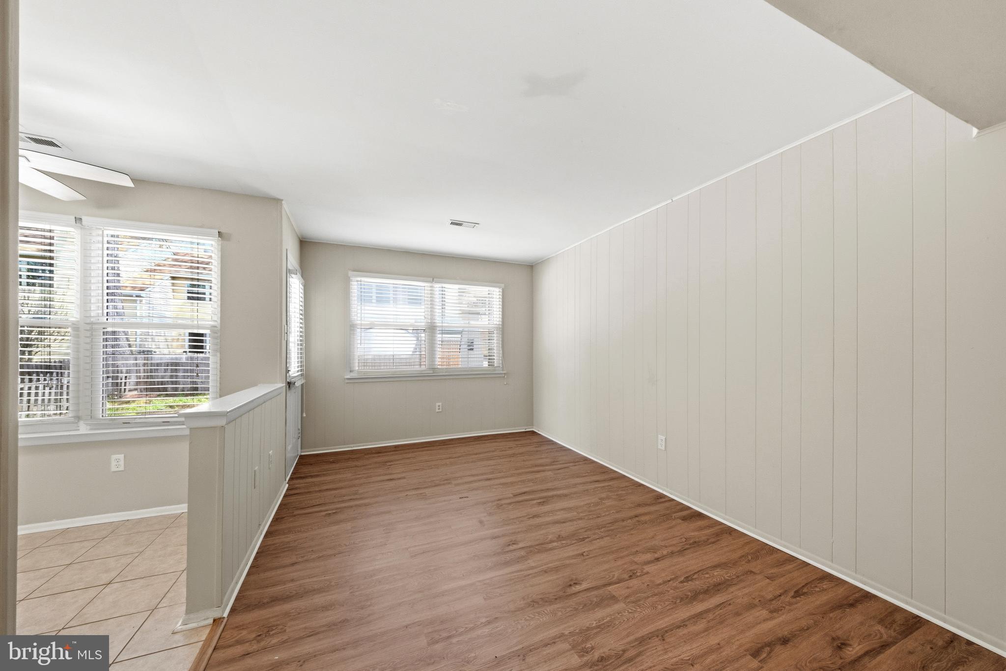 202 Shady Lane Marlton, NJ 08053 - Photo 14 of 38 an empty room with wooden floor and windows
