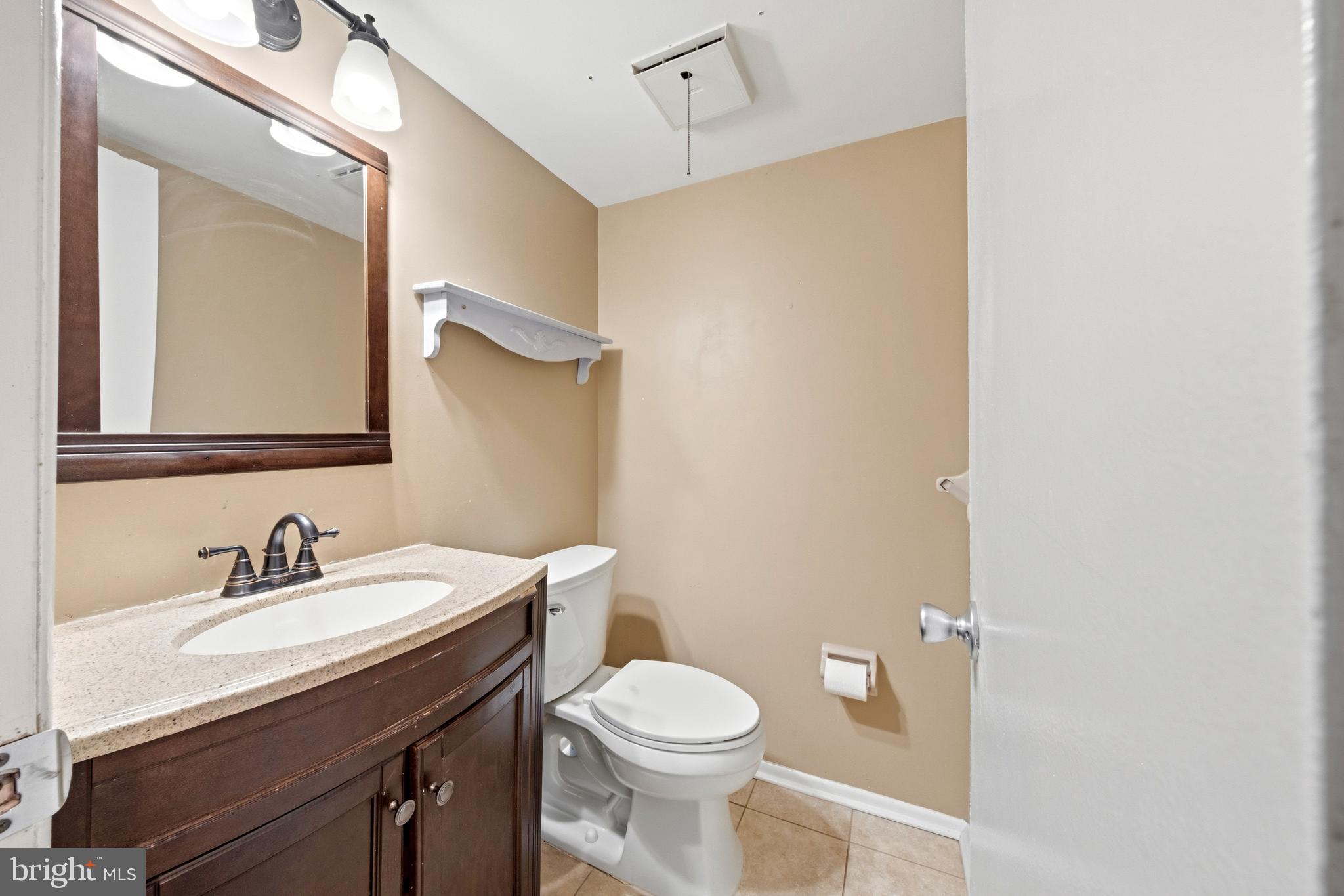 202 Shady Lane Marlton, NJ 08053 - Photo 16 of 38 a bathroom with a sink a toilet and a mirror