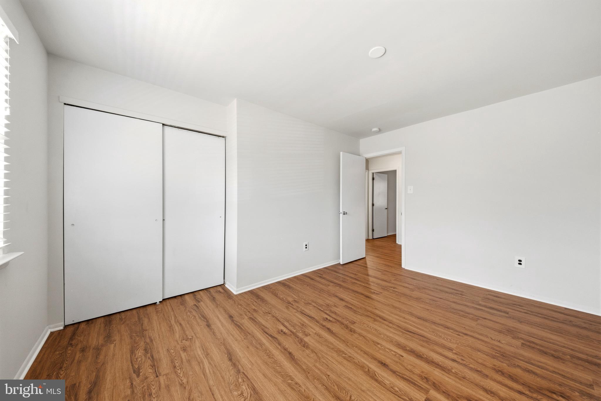 202 Shady Lane Marlton, NJ 08053 - Photo 24 of 38 a view of an empty room with wooden floor