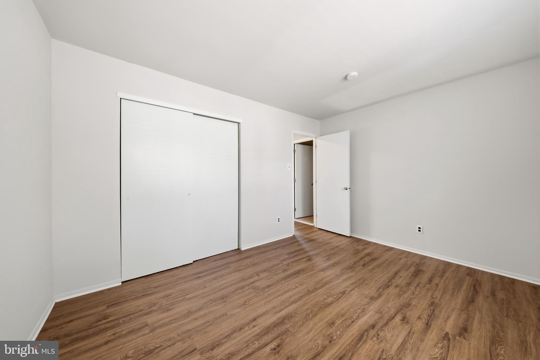 202 Shady Lane Marlton, NJ 08053 - Photo 30 of 38 a view of an empty room with wooden floor