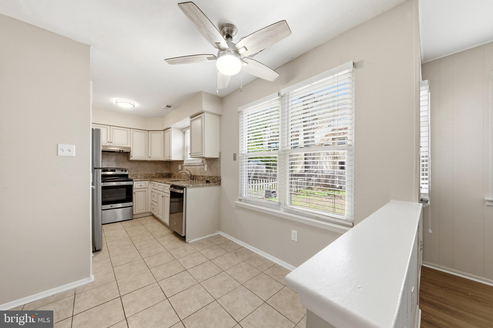202 Shady Lane Marlton, NJ 08053 - Photo 6 of 38 a kitchen with a stove a sink and a refrigerator