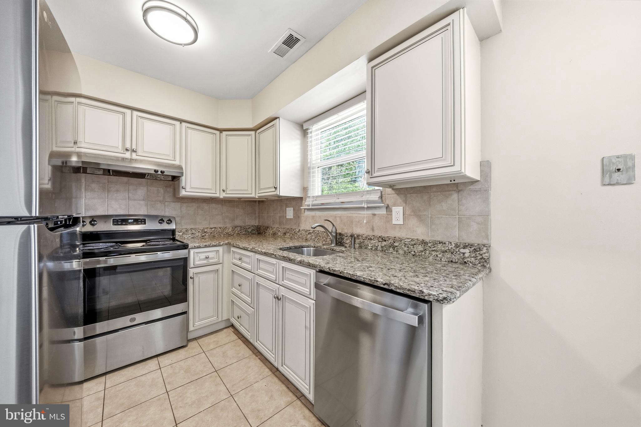 202 Shady Lane Marlton, NJ 08053 - Photo 7 of 38 a kitchen with stainless steel appliances granite countertop a sink stove and cabinets