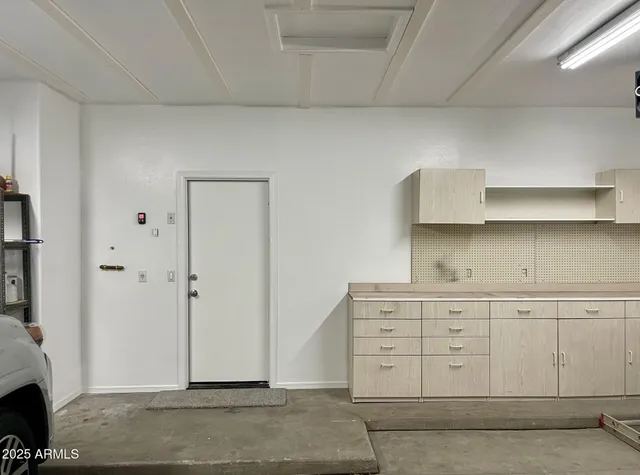 a view of a kitchen with cabinets