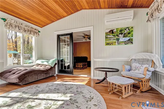 a bedroom with bed and a window