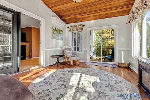a bedroom with a bed and a chandelier fan