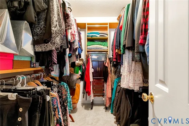 a bedroom with furniture and a flat tv screen