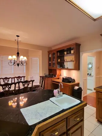 a kitchen with a table chairs and stove