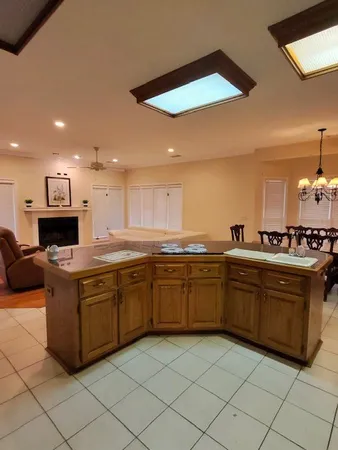 a kitchen with stainless steel appliances granite countertop a sink and a refrigerator