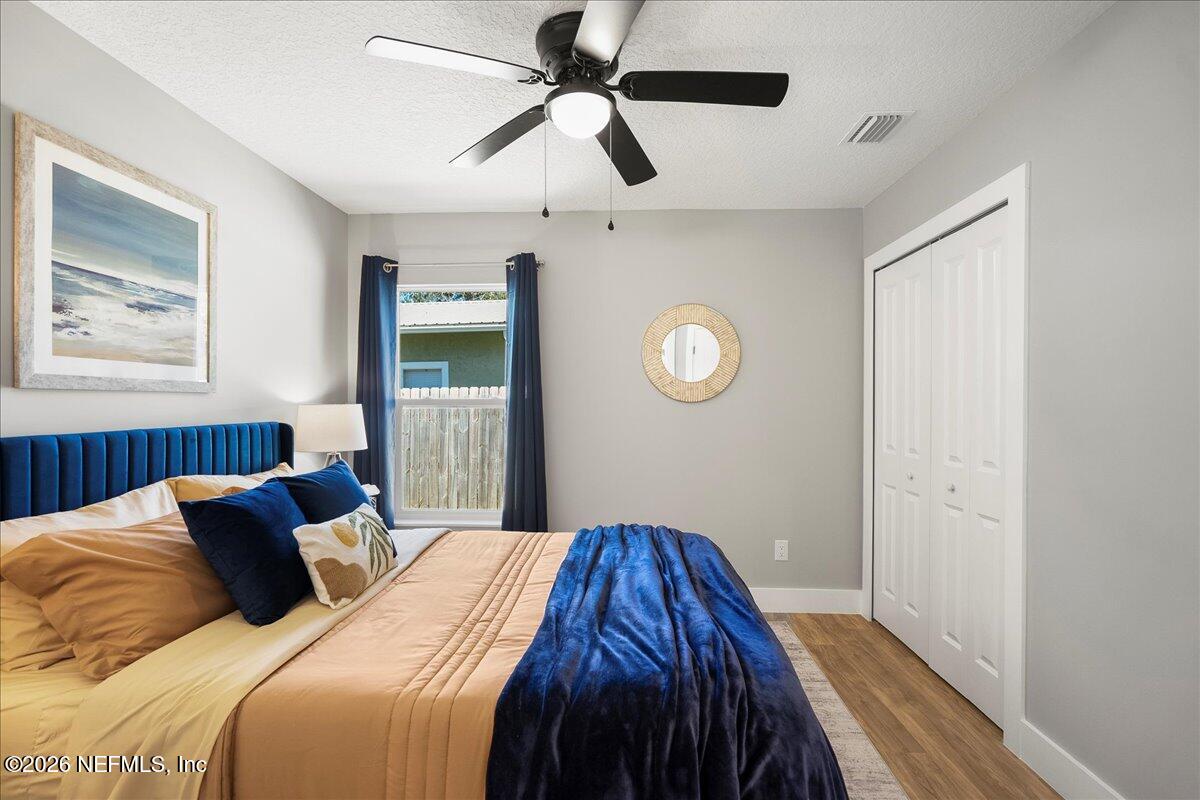 800 9th Street St. Augustine, FL 32084 - Photo 16 of 45 a bedroom with a bed and a window