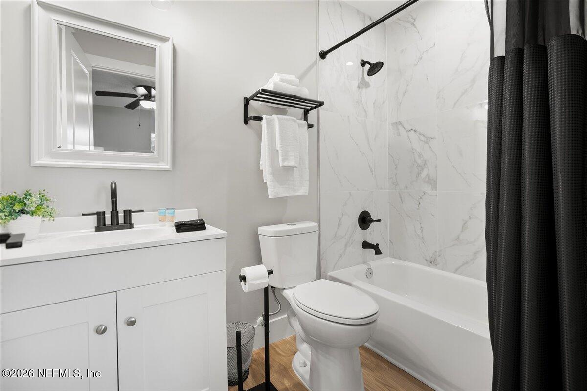 800 9th Street St. Augustine, FL 32084 - Photo 19 of 45 a bathroom with a sink a toilet and shower