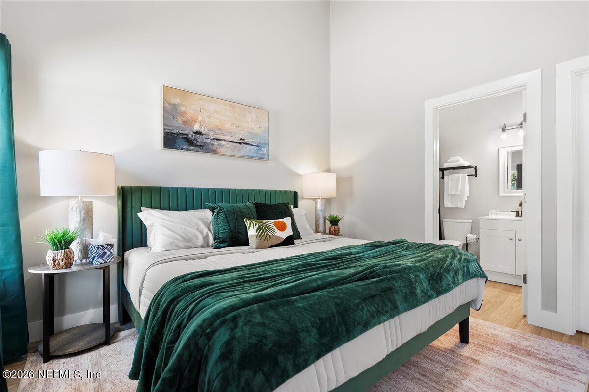 800 9th Street St. Augustine, FL 32084 - Photo 22 of 45 a bedroom with a bed and painting on the wall