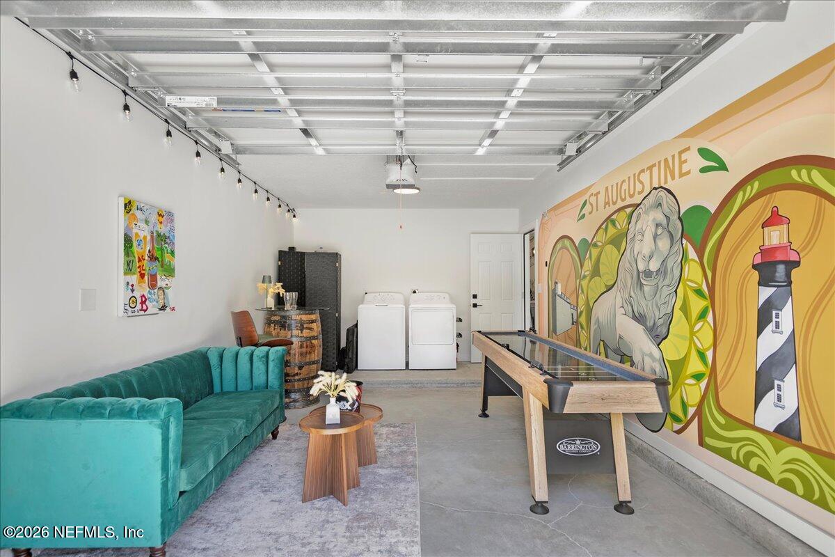 800 9th Street St. Augustine, FL 32084 - Photo 36 of 45 a living room with patio furniture and a chandelier