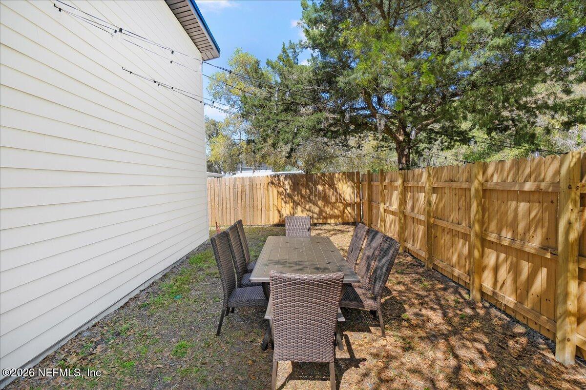 800 9th Street St. Augustine, FL 32084 - Photo 39 of 45 a view of a chairs and table in the patio