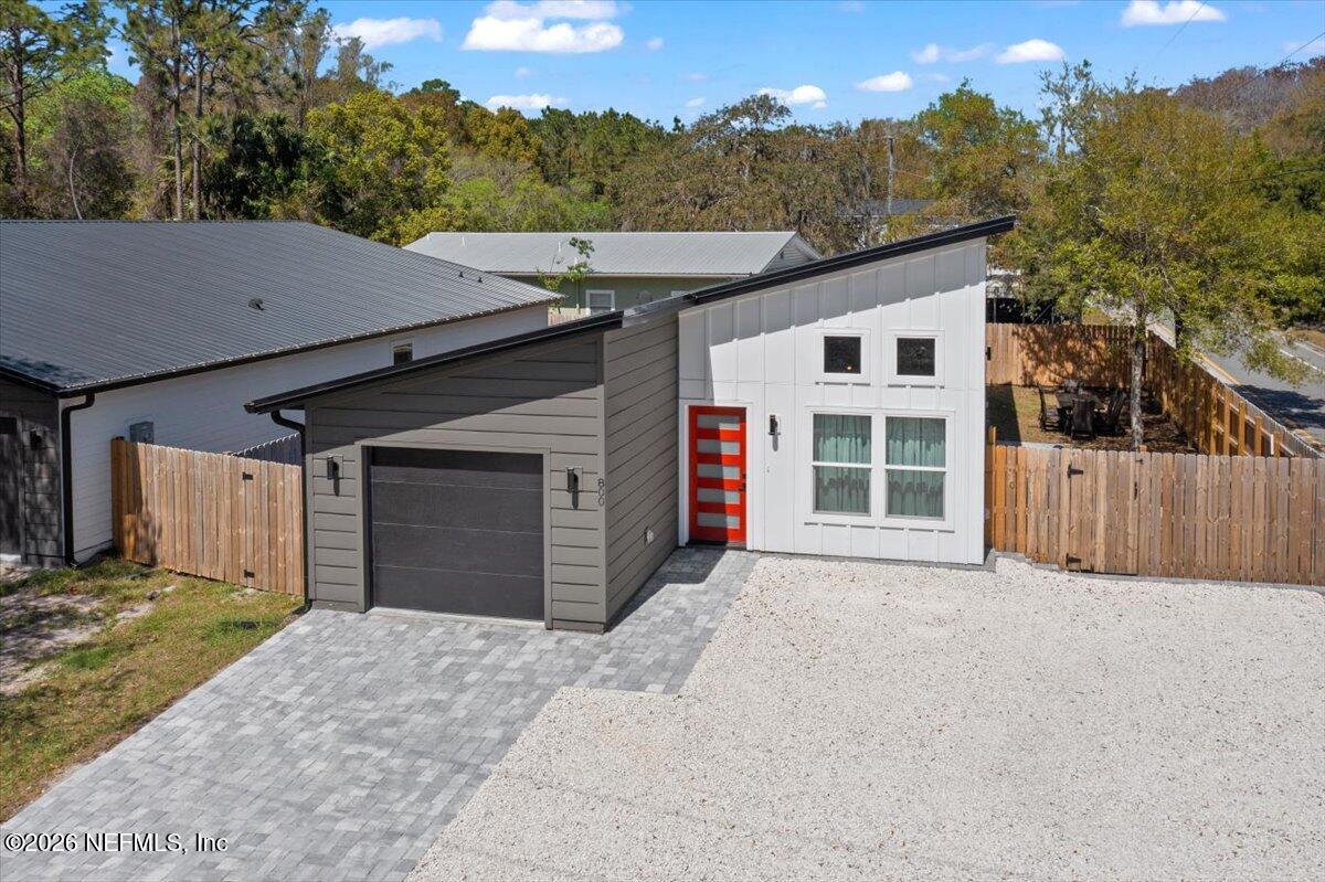 800 9th Street St. Augustine, FL 32084 - Photo 41 of 45 front view of a house with a yard and garage