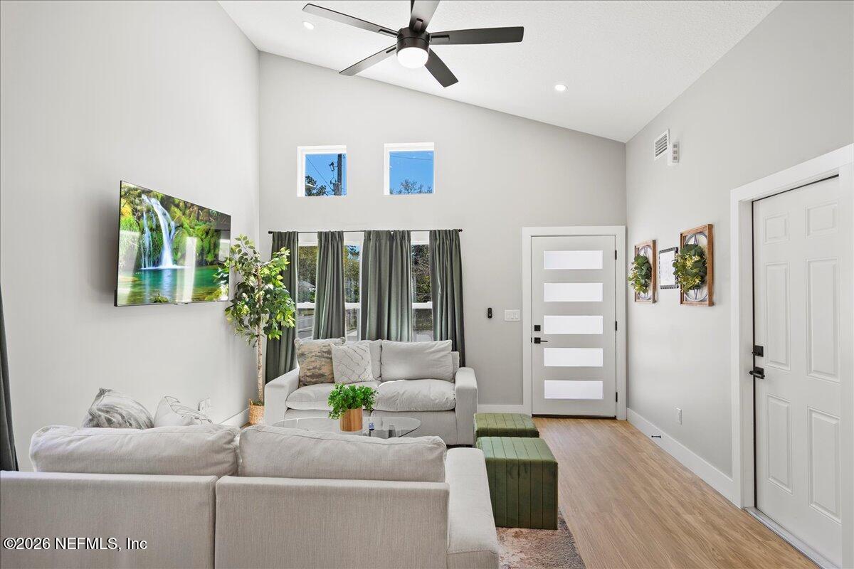 800 9th Street St. Augustine, FL 32084 - Photo 7 of 45 a living room with furniture and a large window