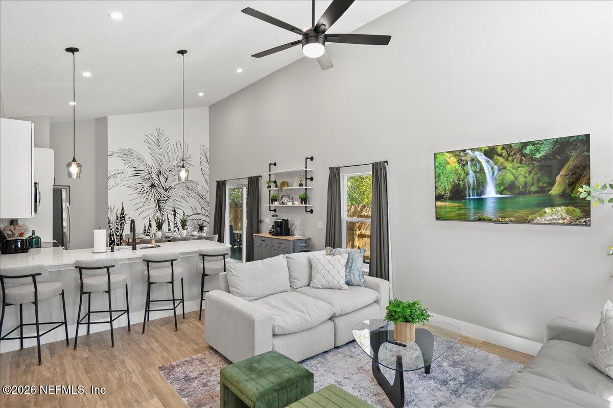 800 9th Street St. Augustine, FL 32084 - Photo 8 of 45 a living room with furniture and a large window