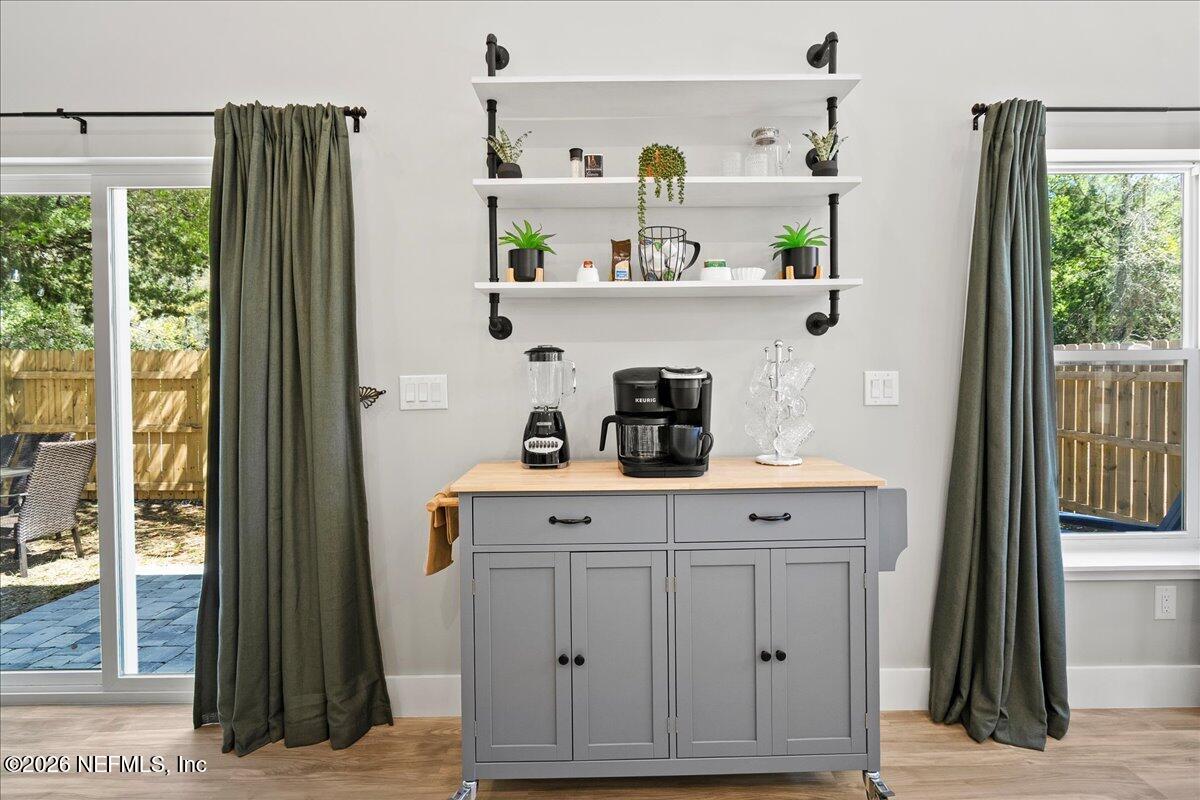 800 9th Street St. Augustine, FL 32084 - Photo 10 of 45 a view of cabinets a sink and a refrigerator in a kitchen