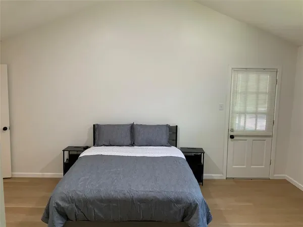 a bedroom with a bed and closet