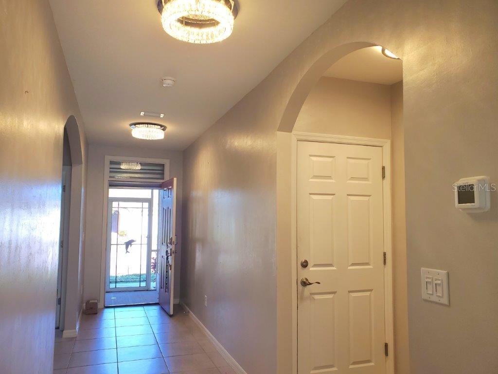 25525 Gorham Lane Punta Gorda, FL 33950 - Photo 13 of 34 a view of hallway with livingroom and window