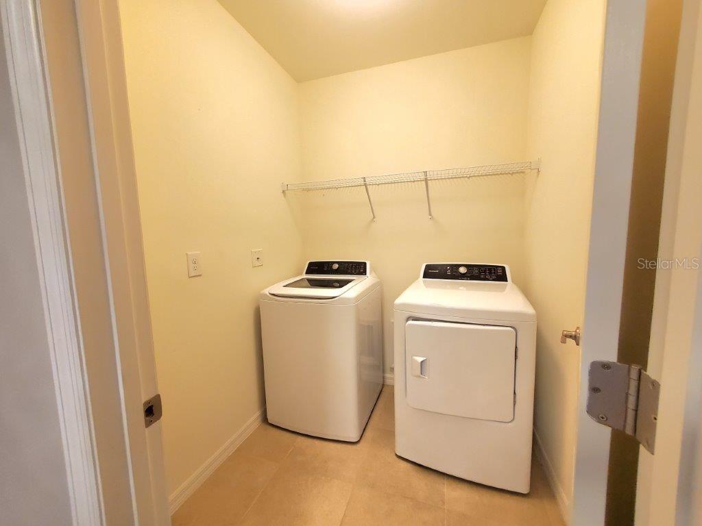 25525 Gorham Lane Punta Gorda, FL 33950 - Photo 16 of 34 a utility room with dryer and washer
