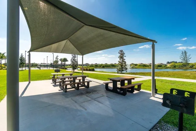 an outdoor space with furniture and umbrella