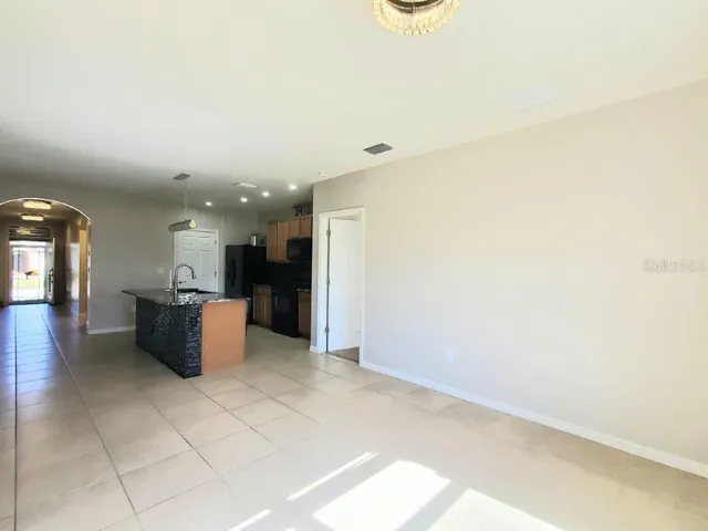 a kitchen with stainless steel appliances a refrigerator and a microwave