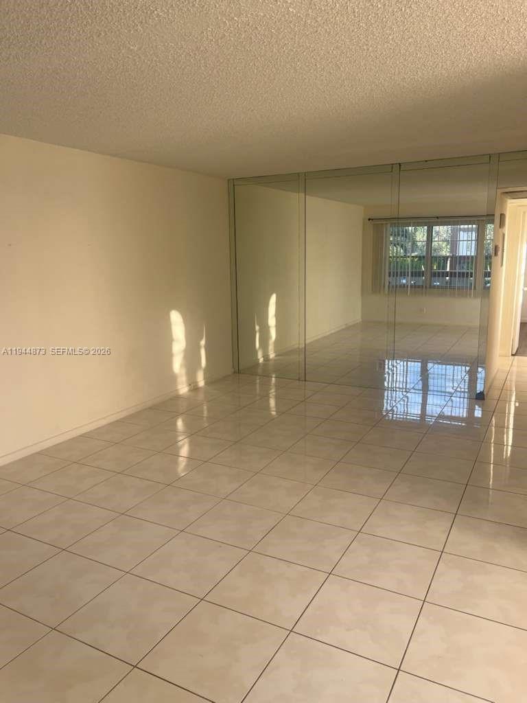 528 Mansfield M, Unit 528 Boca Raton, FL 33434 - Photo 2 of 14 a view of a room with racks on the wall