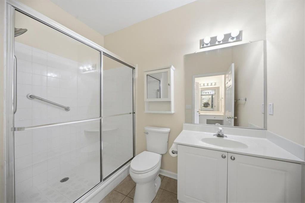 111 Stonegate Lane Canton, GA 30114 - Photo 17 of 30 a bathroom with a sink toilet and shower