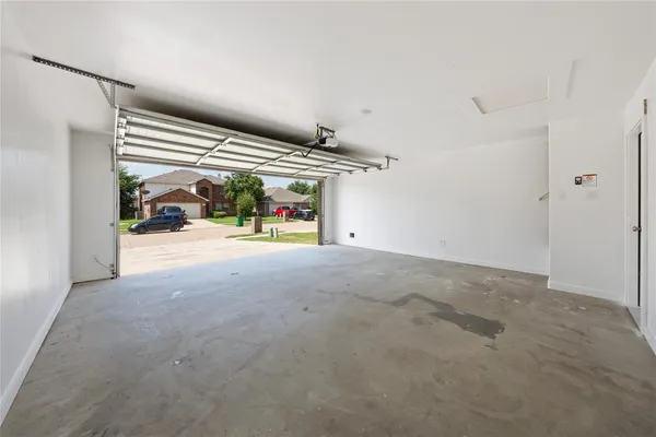 a view of garage with refrigerator