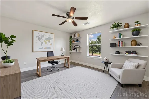 a bedroom with furniture and a window