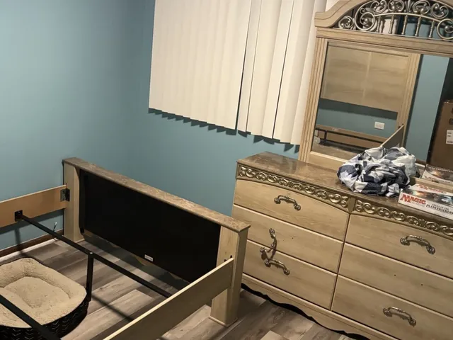 a view of large tree and wooden fence