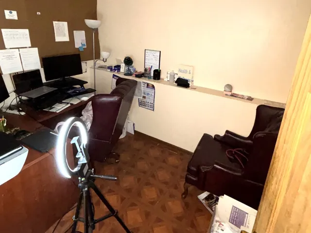 a view of workspace with wooden floor windows