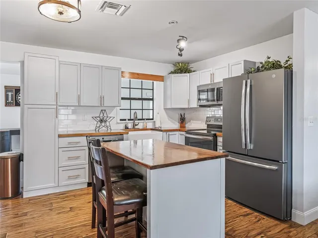 a kitchen with a sink cabinets and window
