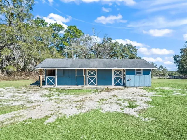 an aerial view of residential house with outdoor space