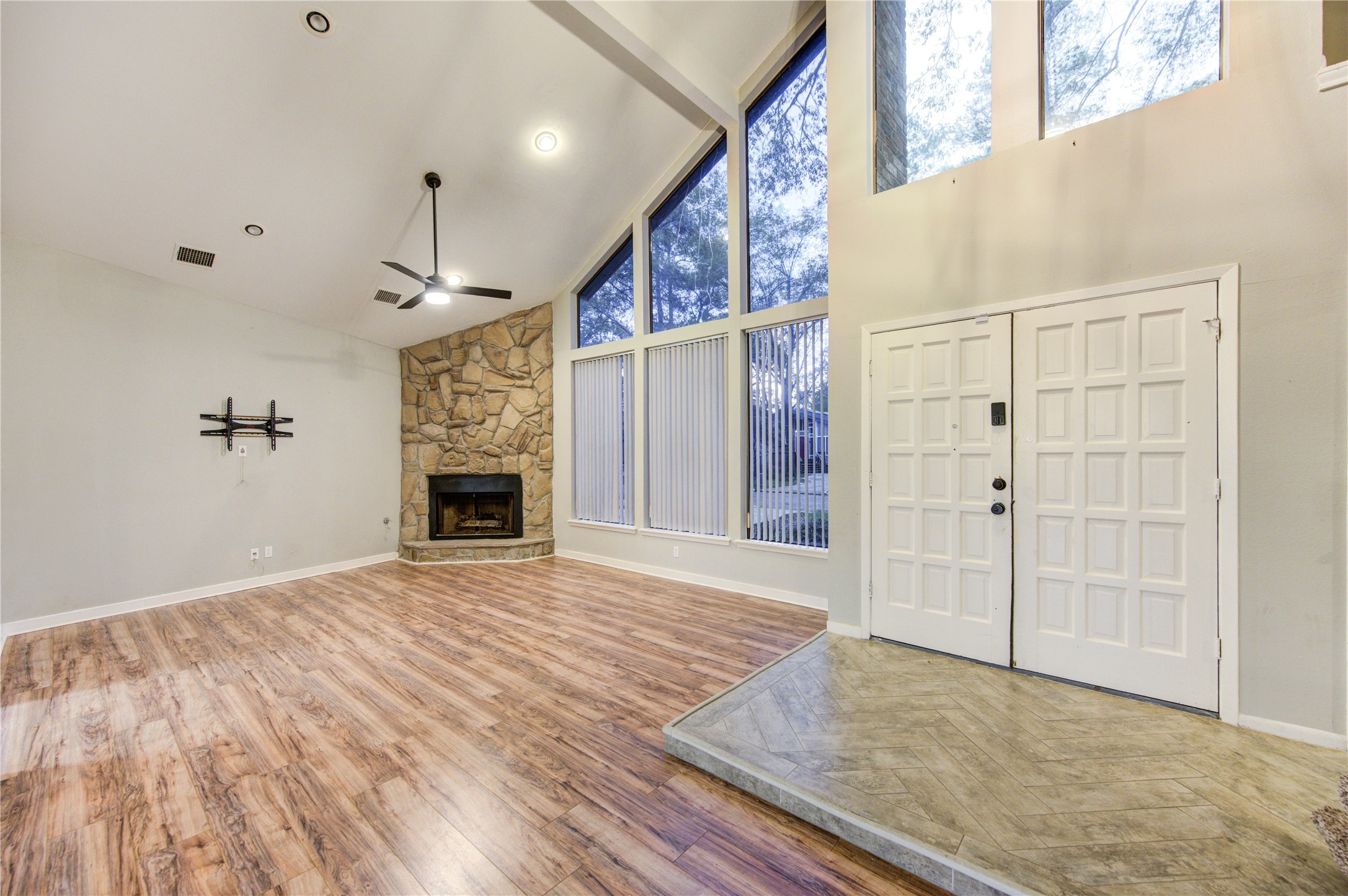 530 Enchanted Lane Spring, TX 77388 - Photo 7 of 26 a view of empty room with wooden floor and fireplace