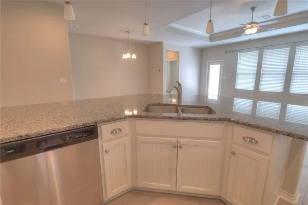 a view of a granite countertop cabinets