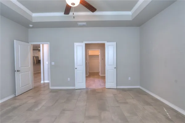 an empty room with closet and wooden floor