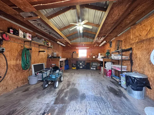 a view of a garage room with wooden furniture