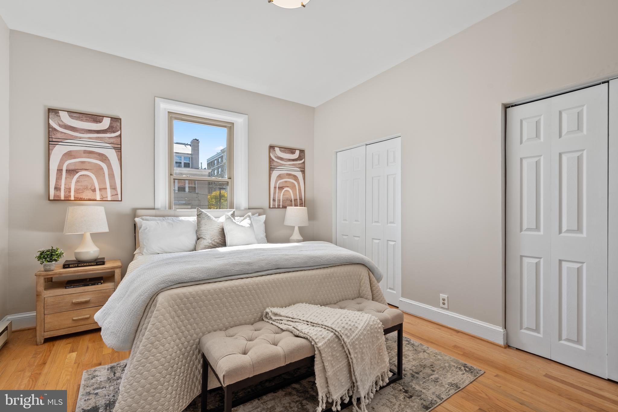 2010 Kalorama Road Northwest, Unit 306 Washington, DC 20009 - Photo 13 of 26 a bedroom with a bed and wooden floor
