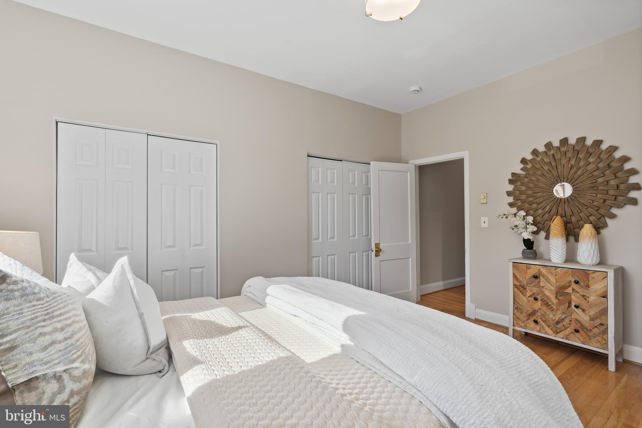 2010 Kalorama Road Northwest, Unit 306 Washington, DC 20009 - Photo 15 of 26 a bedroom with a bed and a painting on the wall