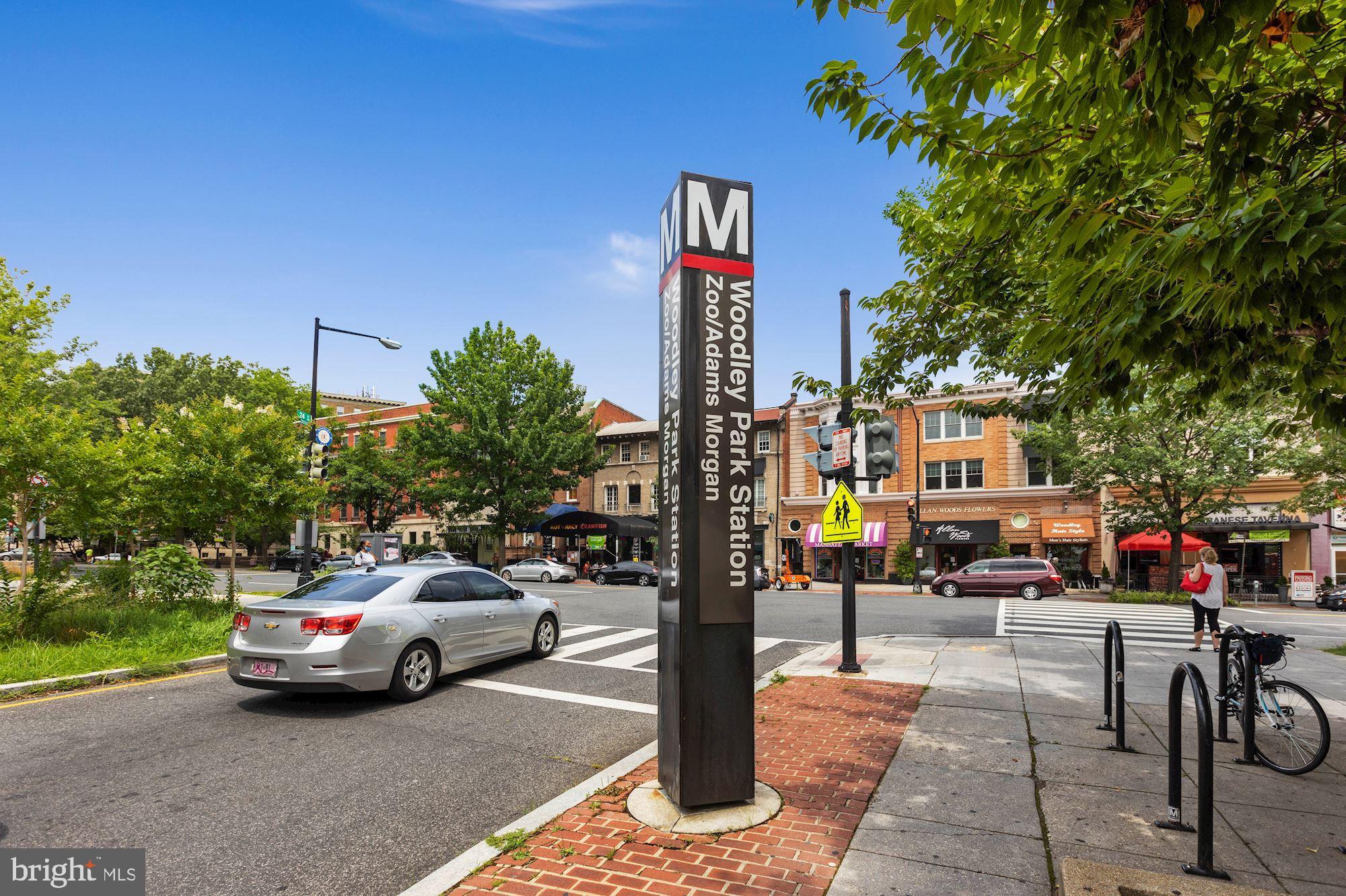 2010 Kalorama Road Northwest, Unit 306 Washington, DC 20009 - Photo 22 of 26 a street view with tall buildings and cars parked on road