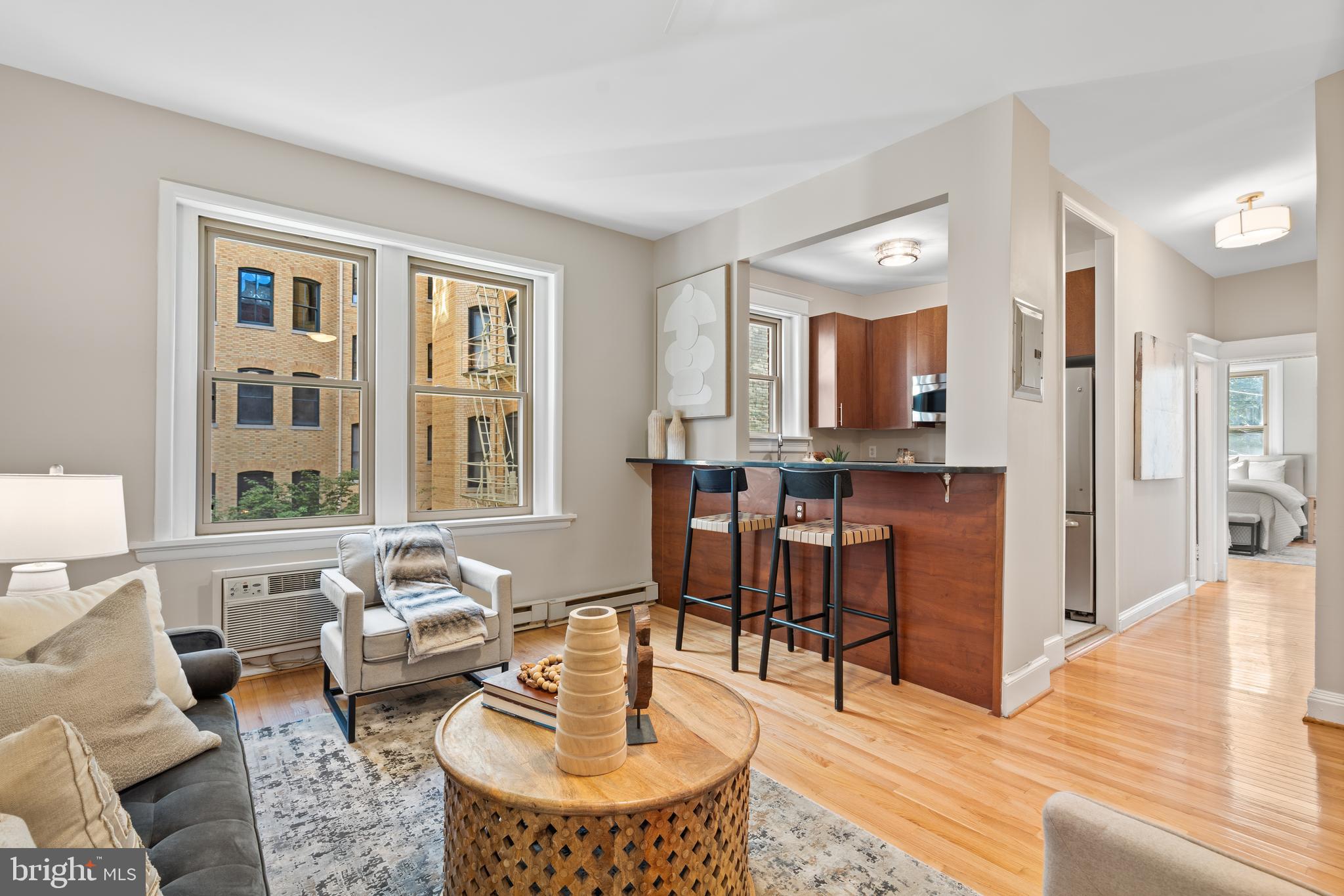 2010 Kalorama Road Northwest, Unit 306 Washington, DC 20009 - Photo 3 of 26 a living room with furniture and a table