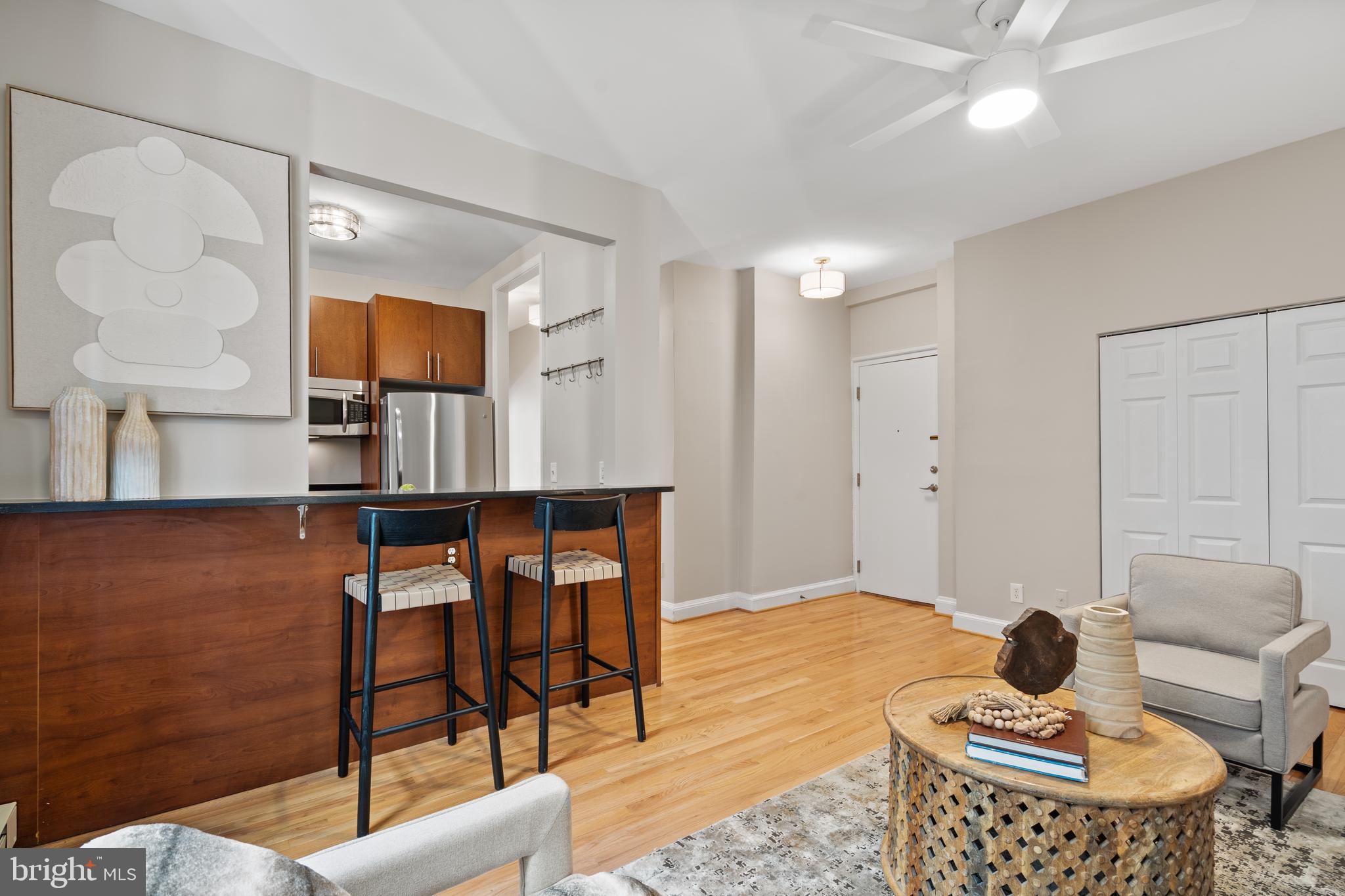 2010 Kalorama Road Northwest, Unit 306 Washington, DC 20009 - Photo 6 of 26 a living room with furniture and wooden floor