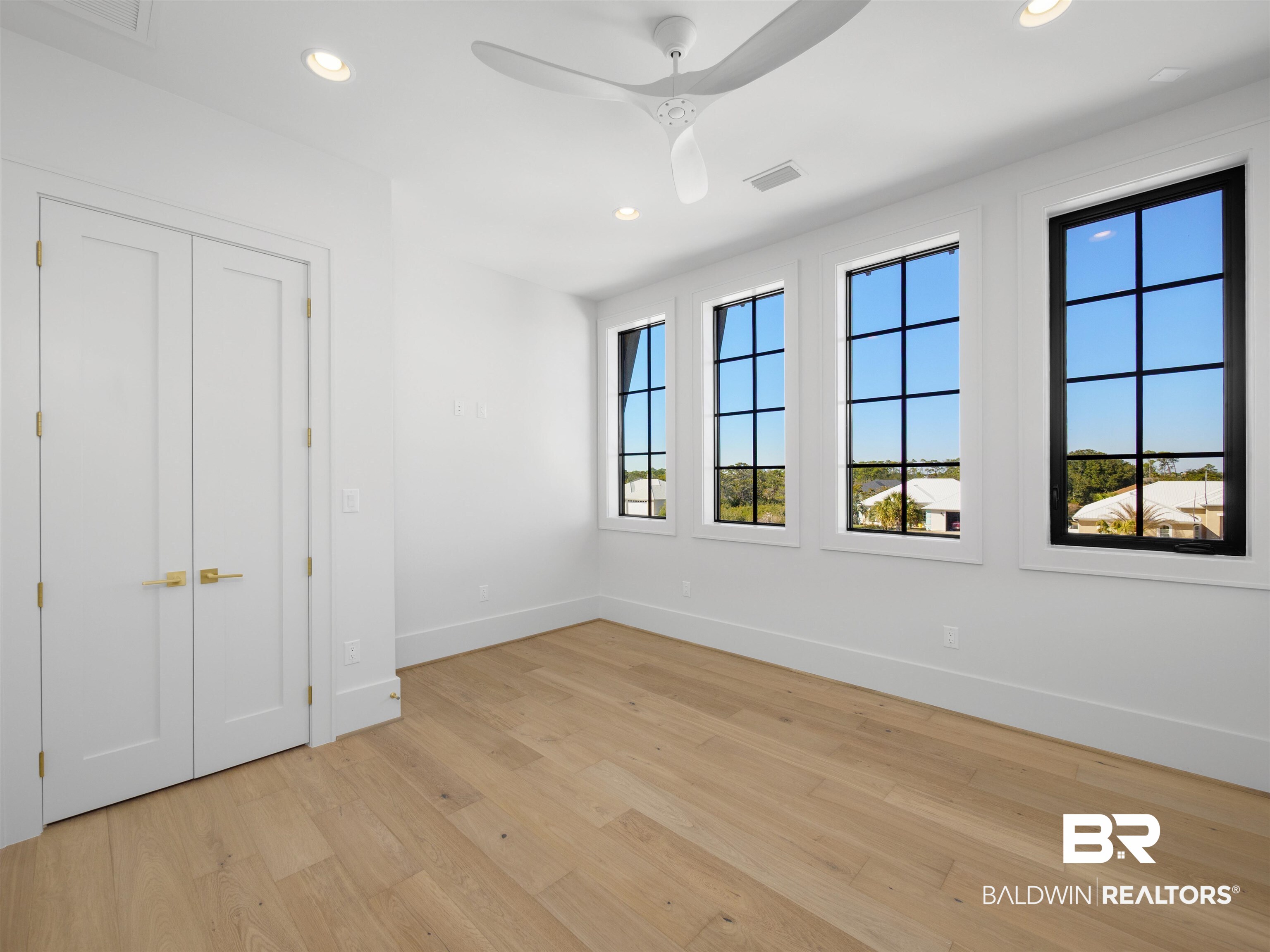 31292 River Road Orange Beach, AL 36561 - Photo 19 of 48 Spare room featuring recessed lighting, visible vents, baseboards, a ceiling fan, and light wood-style floors