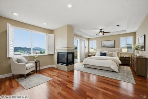 a spacious bedroom with a large bed and a couch