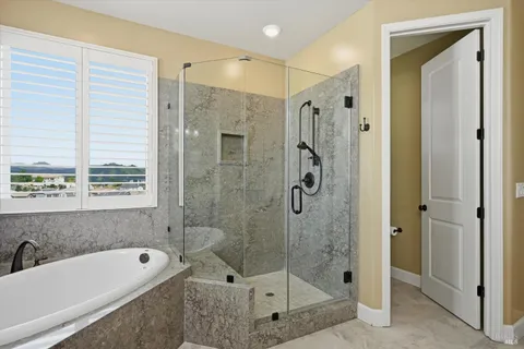 a bathroom with a shower a toilet a sink and shower