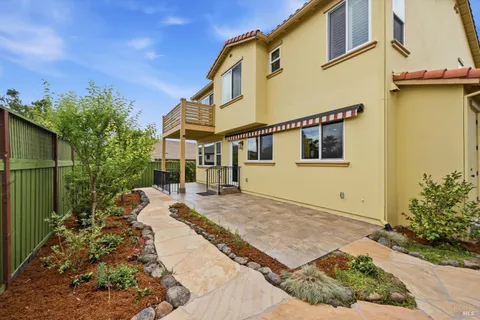 a view of a house with a backyard