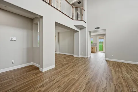 a view of an entryway with wooden floor