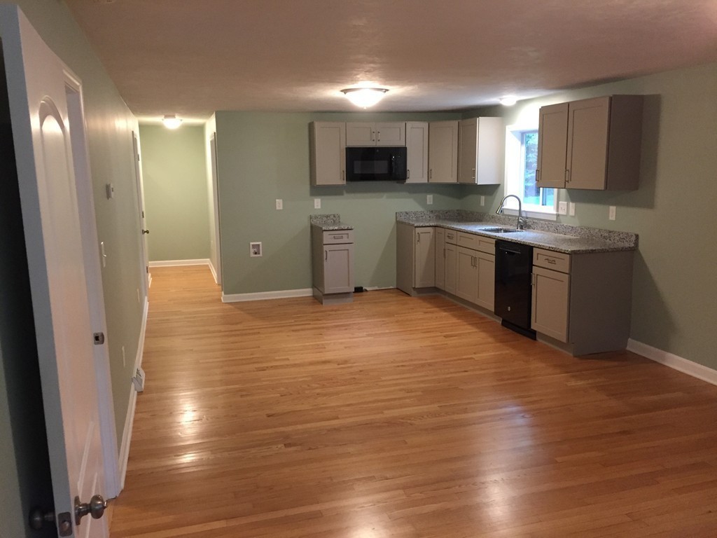 10 Oak Road Charlton, MA 01507 - Photo 3 of 11 a kitchen with granite countertop a sink and cabinets