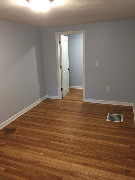 10 Oak Road Charlton, MA 01507 - Photo 8 of 11 a view of an empty room with wooden floor
